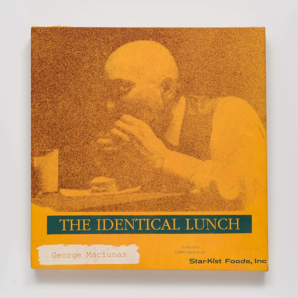 A stylized print of a person eating at a table in shades of orange and brown with green and yellow text. Alt-text generated by AI. Transcribed Text:  THE IDENTICAL LUNCH George Maciunas TUNA FISH COMPLIMENTS OF StarKist Foods, Inc.