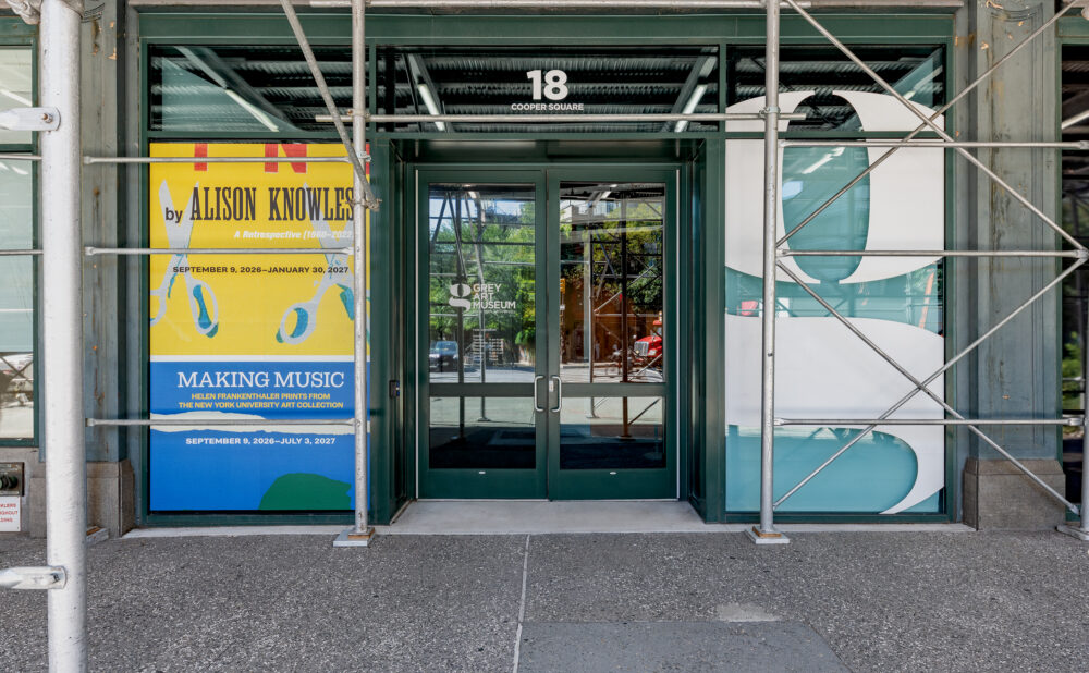 Scaffolded entrance to the Grey Art Museum at 18 Cooper Square, with exhibition window display for Alison Knowles and Helen Frankenthaler.