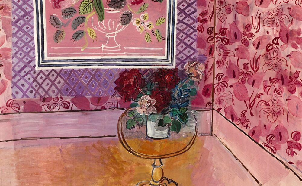 A colorful painting of a floral and geometric patterned room with a bouquet of roses on a round table, with French text painted at the bottom of the composition that reads: 1901 30 ans ou la vie en rose Raoul Dufy 1931.