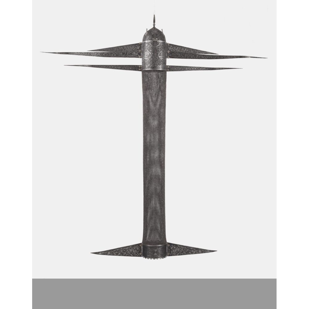 Vertical sculpture depicting a multi-tiered, metallic projectile or architectural spire structure against a plain white background by Shahpour Pouyan. (Alt-text generated by AI)