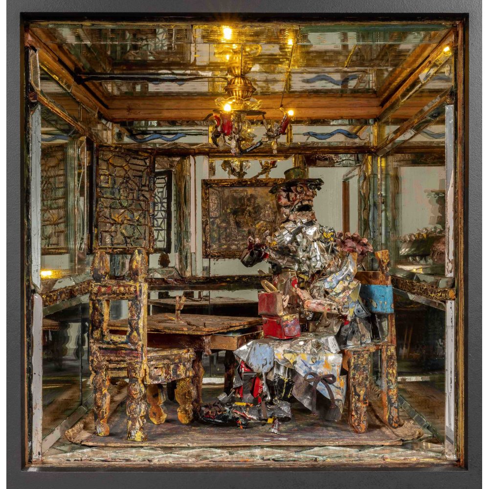 A diorama of a dining room with a figure made of reflective scraps seated at a table, surrounded by mirrors.