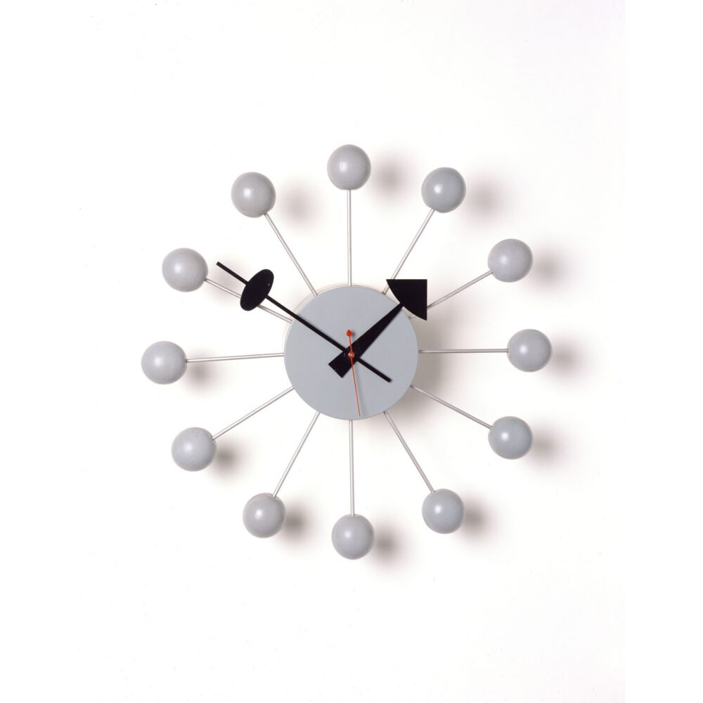 George Nelson Ball Clock featuring radiating metal spokes topped with spherical wooden markers around a central dial. (Alt-text generated by AI)