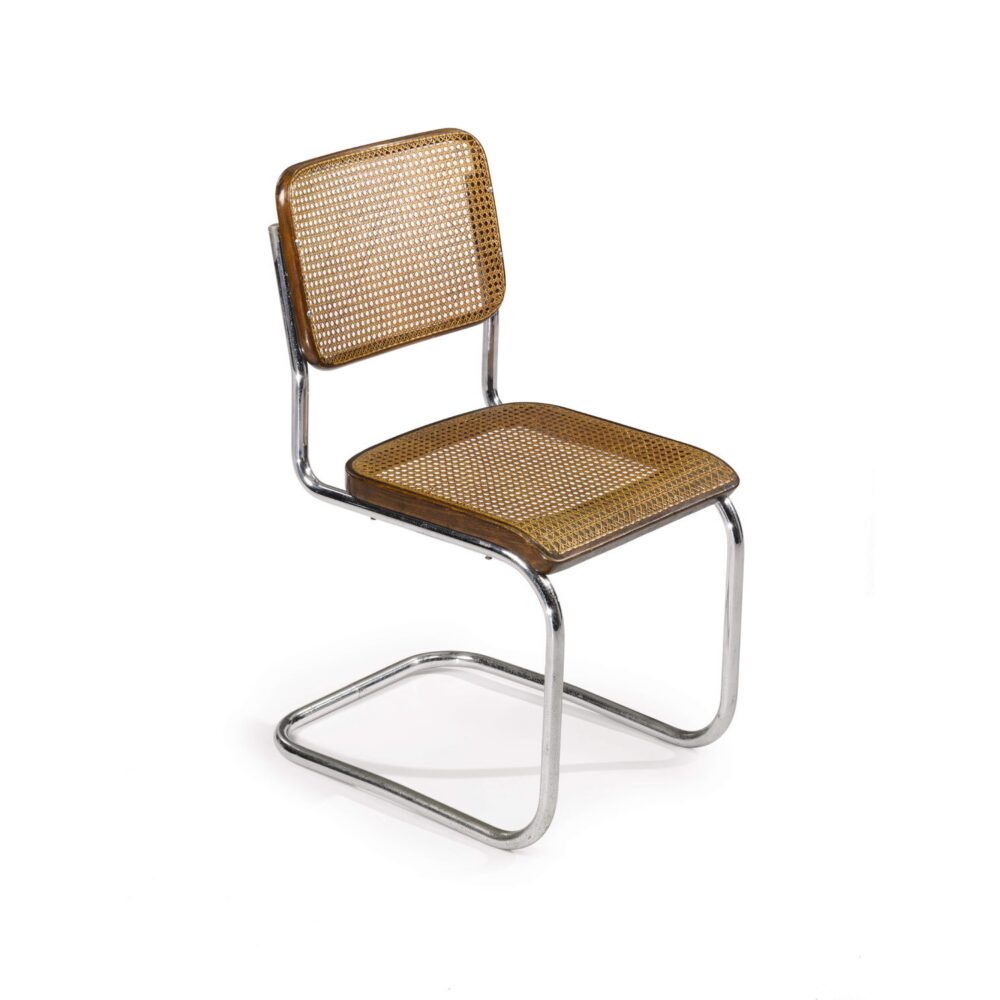 Marcel Breuer Model B32 cantilever chair featuring tubular steel frames and woven cane seat and back panels. (Alt-text generated by AI)