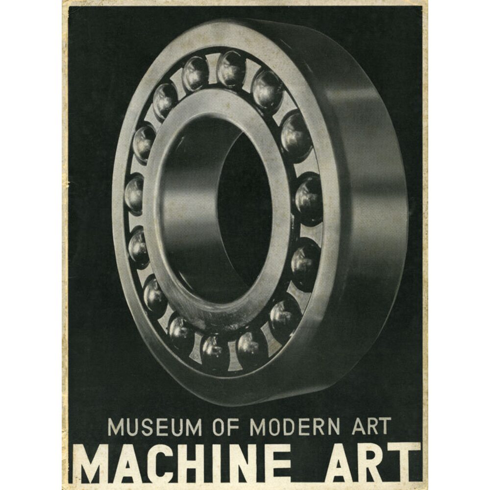 Josef Albers exhibition catalogue cover for MoMA's "Machine Art" featuring a close-up photograph of a metallic ball bearing. (Alt-text generated by AI)