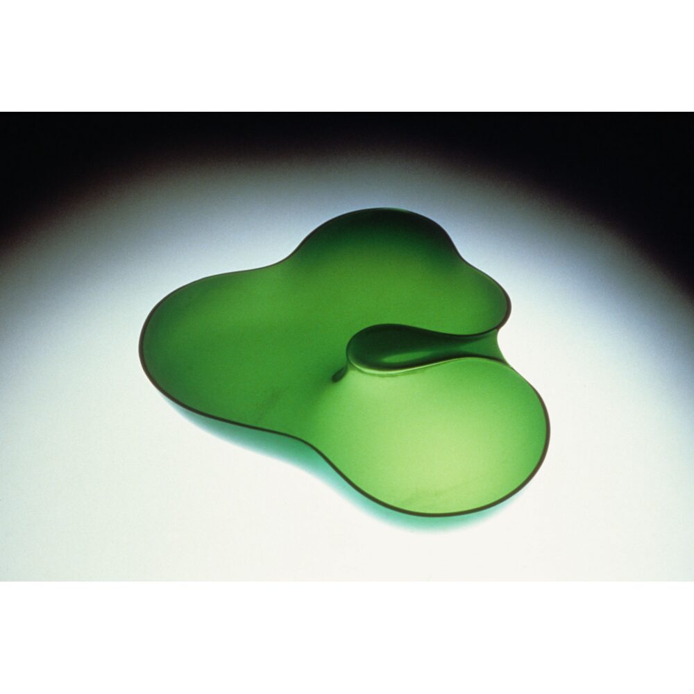 Eva Zeisel organic clover-shaped glass bowl rendered in vivid translucent green. (Alt-text generated by AI)