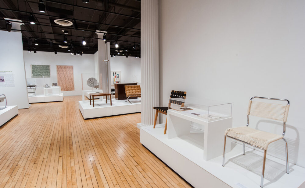 Foreground platform displaying chairs alongside additional design objects in the background. (Alt-text generated by AI)