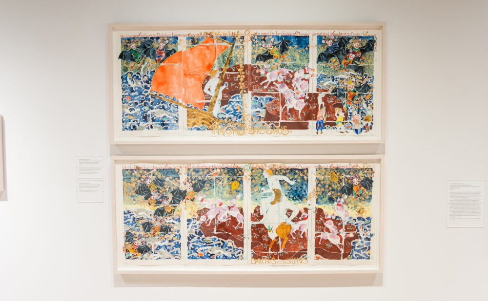 Straight-on view of two stacked rectangular frames displaying colorful multi-panel illustrations. (Alt-text generated by AI)