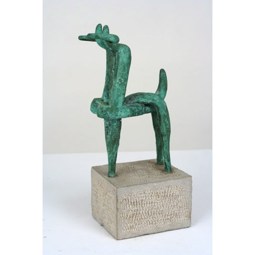 Abstract green ibex sculpture on a stone base.