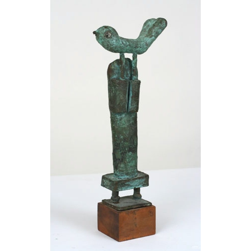 Bronze sculpture with bird with raised tail feathers perched on a humanoid figure standing atop a wooden pedestal.