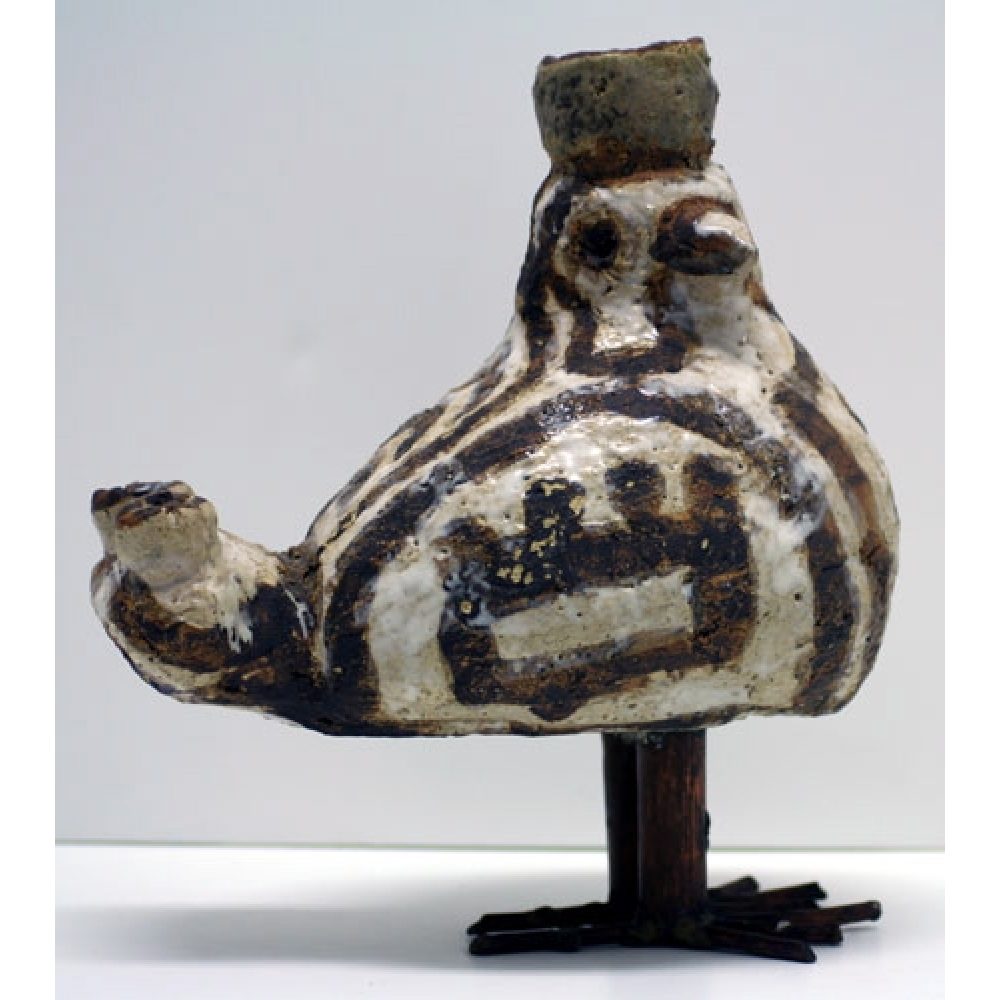 Ceramic bird sculpture with brown and white geometric patterns.