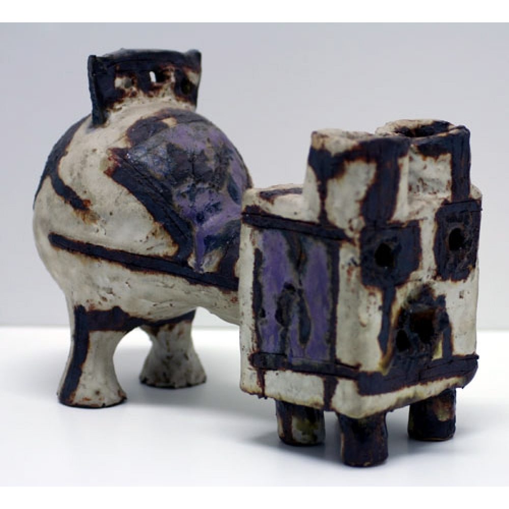 Ceramic sculpture with spherical and rectangular forms in white, blue, and gray.