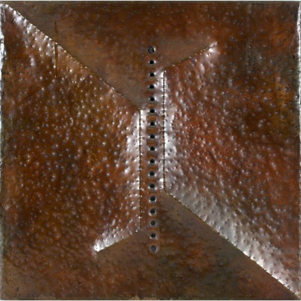 Artwork with a textured, rust-colored metallic surface and a central vertical line of circular perforations. The work has been hammered to create two opposing triangular shapes that converge towards the middle