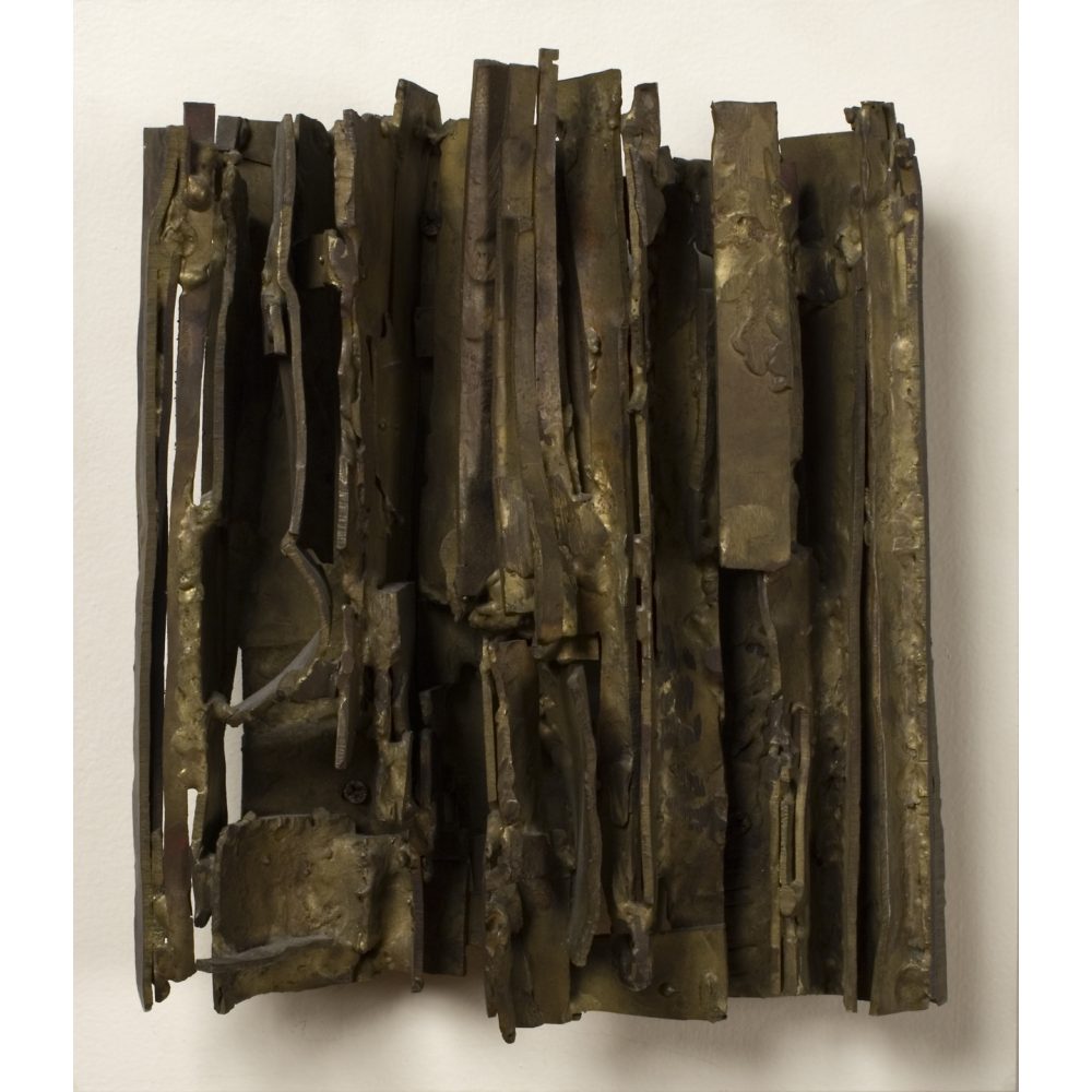 Bronze sculpture with layered metal strips creating a textured and complex appearance. Alt-text generated by AI.