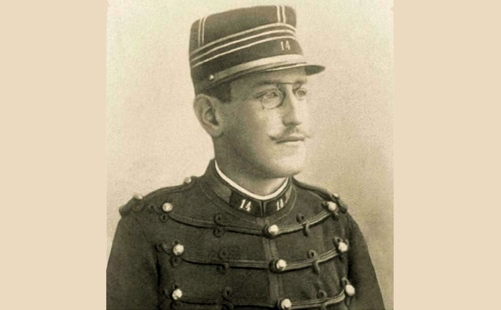 Photograph of Alfred Dreyfus in a military uniform and glasses, gazing to the right
