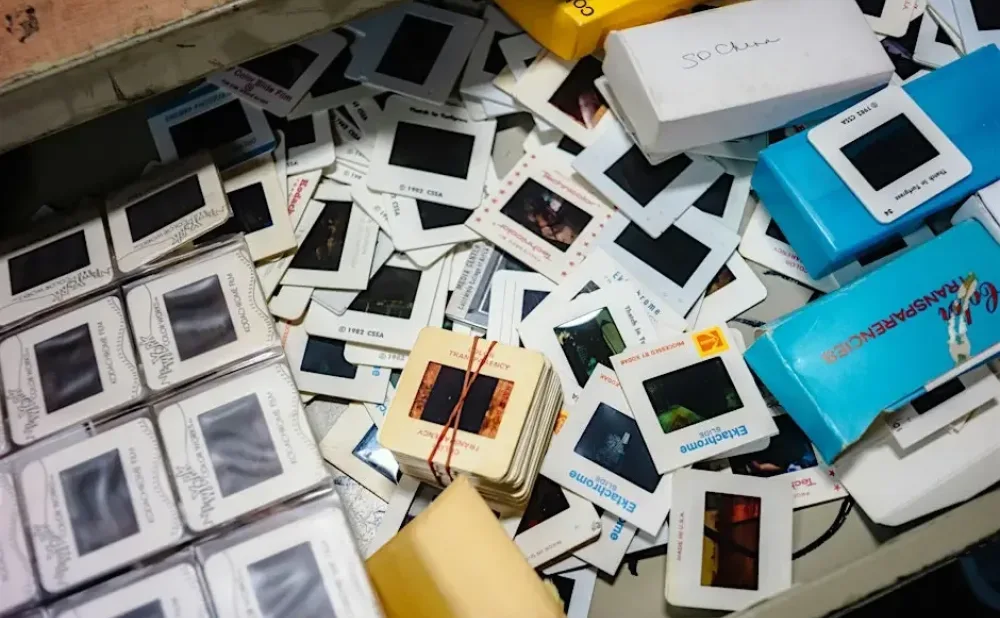 slides  piled up and spread out on a table
