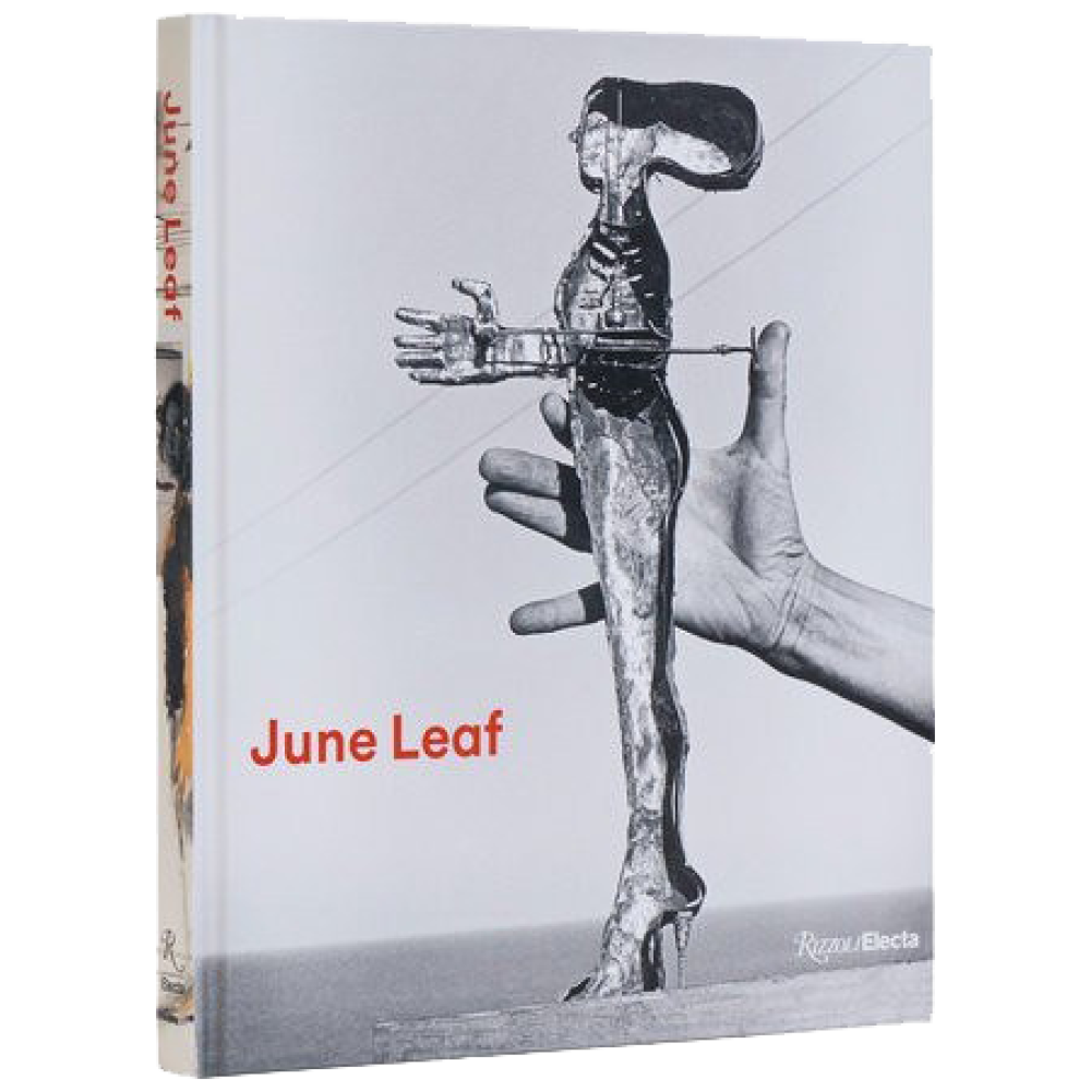 Grey, monochromatic book cover the words, "June Leaf" written in red and a figurative sculpture being held by a hand