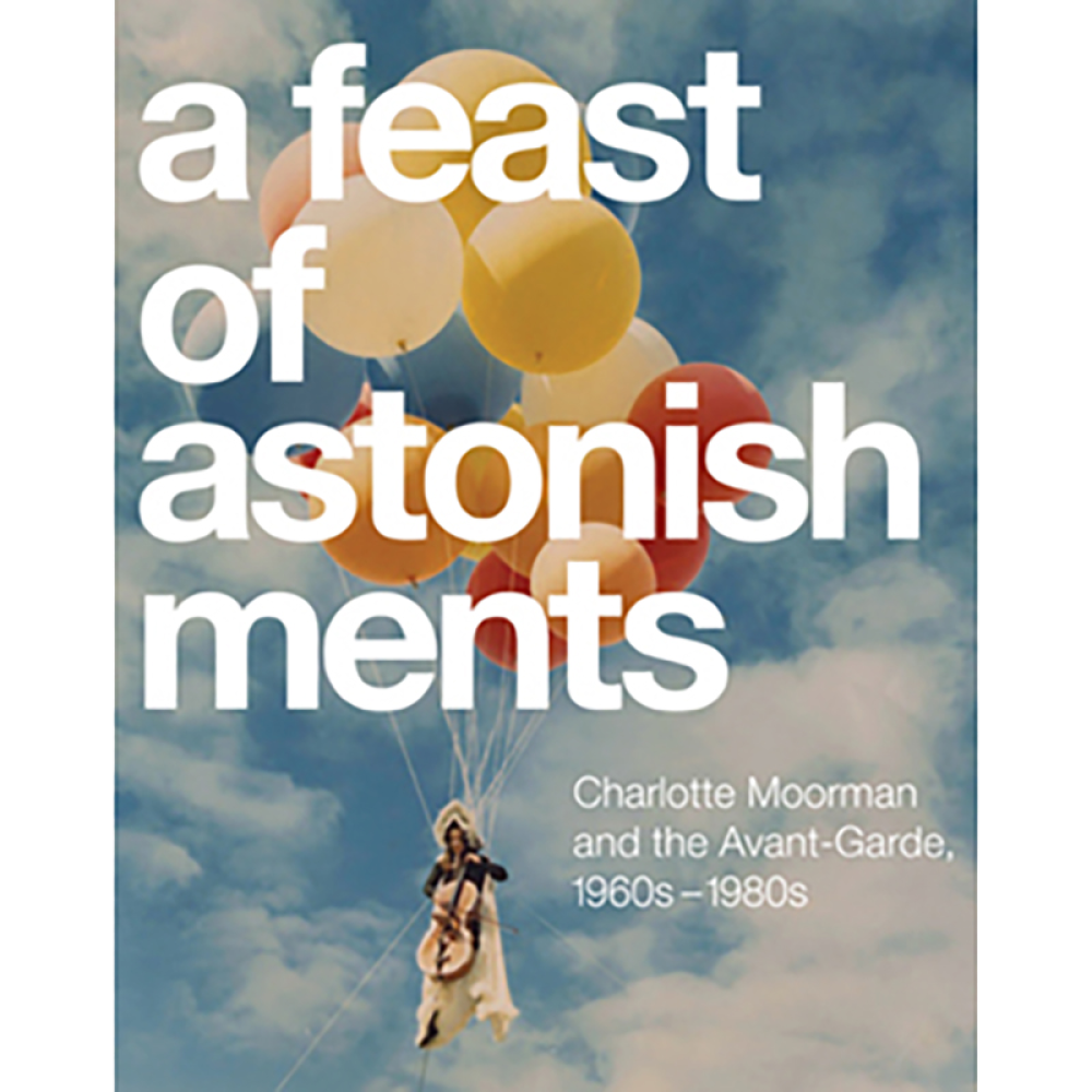 Book cover with a person hanging from colorful balloons in the sky, titled "a feast of astonishments."
