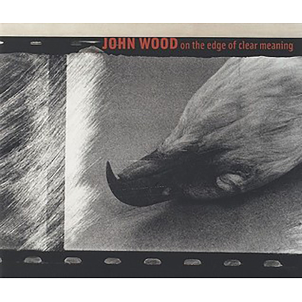Book cover with  a monochromatic grayscale design featuring a detailed, close-up image of a bird's head, positioned with the chin facing upward, it's eye closed. At the top in small red text is the title JOHN WOOD on the edge of clear meaning.